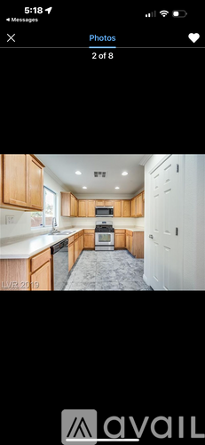 A kitchen with wooden cabinets and a white countertop.