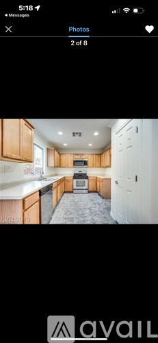 A kitchen with wooden cabinets and a white countertop.