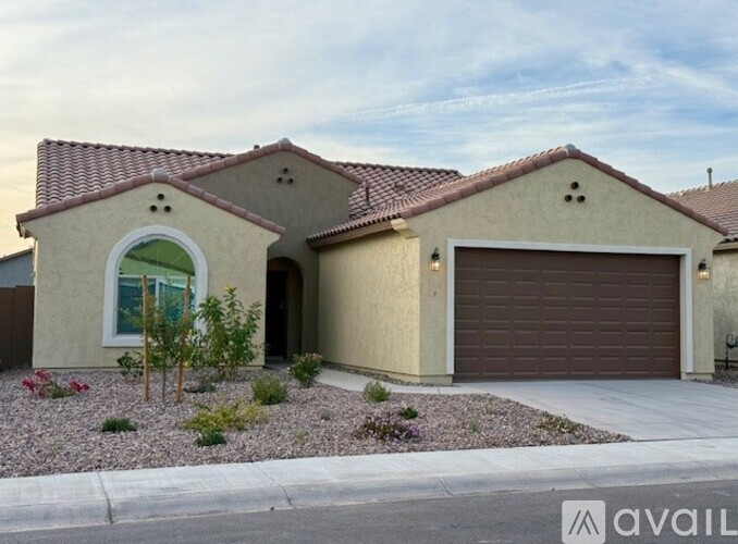 A house with a brown roof and a garage door.