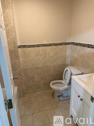 A bathroom with a toilet and a sink.