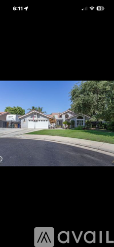 A house with a white garage door is visible.