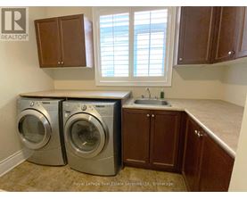 A laundry room with a washer and dryer in it.