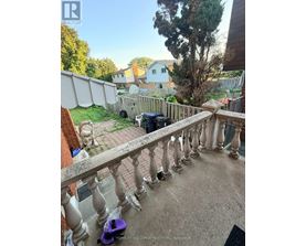 A balcony with a purple scooter on it.