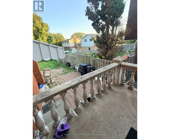 A balcony with a purple scooter on it.
