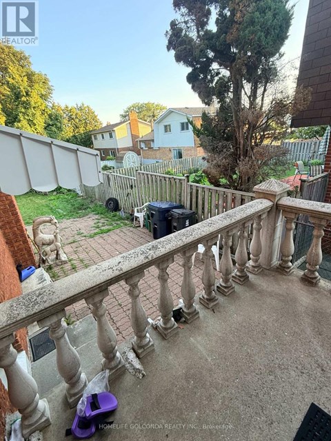 A balcony with a purple scooter on it.
