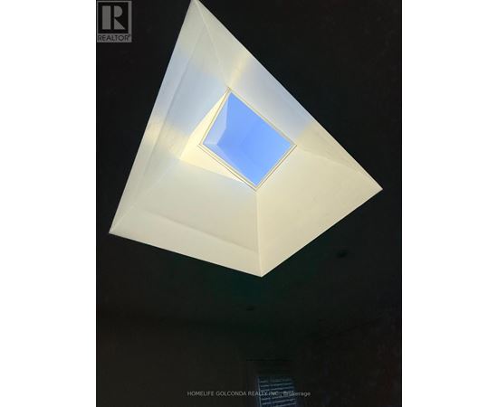 A triangular prism with a blue square in the middle.