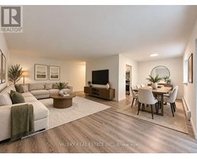 A modern living room with a couch, coffee table, and television.