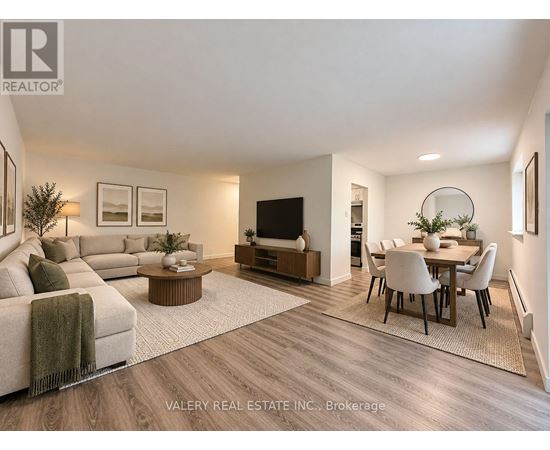 A modern living room with a couch, coffee table, and television.