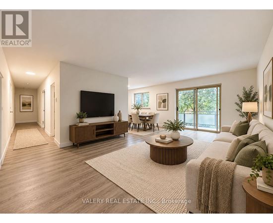 A living room with a flat screen TV, a sofa, and a coffee table.