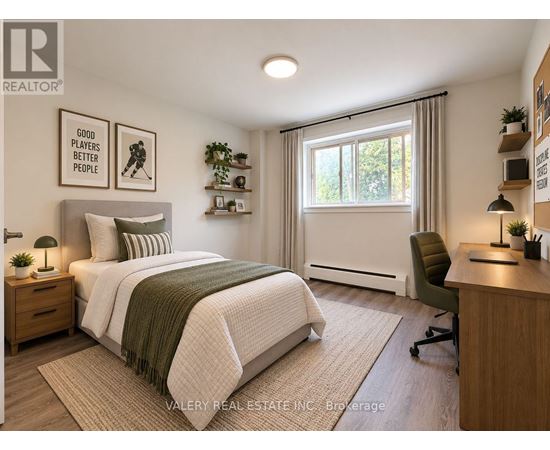 A bedroom with a bed, desk, and chair.