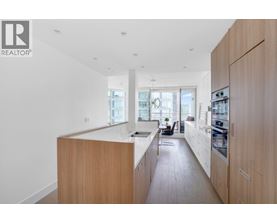 A modern kitchen with wooden cabinets and a large island.