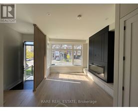A spacious room with a view of the street through the window.