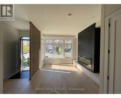 A spacious room with a view of the street through the window.