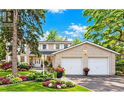 A house with a white garage door and a driveway.