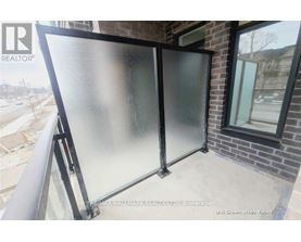 A glass door is installed on a balcony.