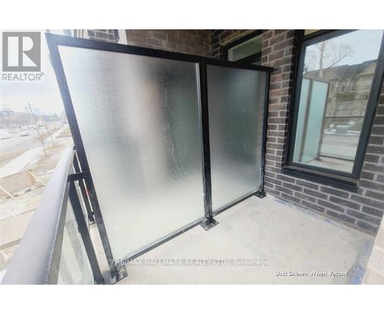 A glass door is installed on a balcony.
