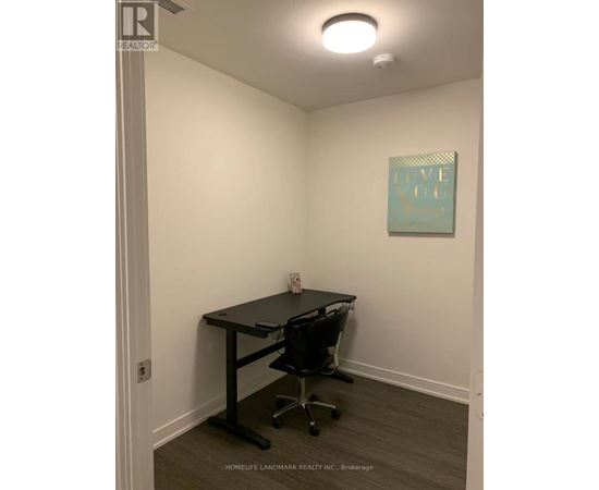 A room with a desk and a chair with a sign that says "Love You".