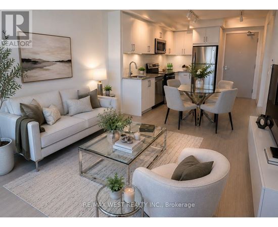 A modern living room with a glass coffee table and a white sofa.