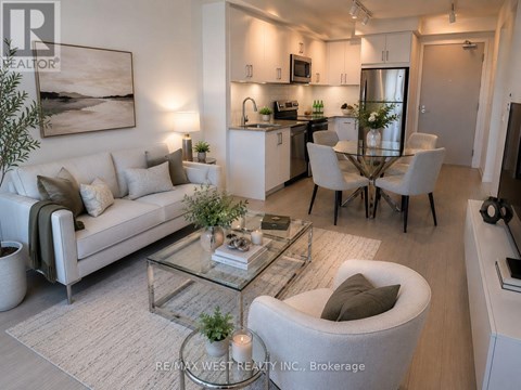 A modern living room with a glass coffee table and a white sofa.