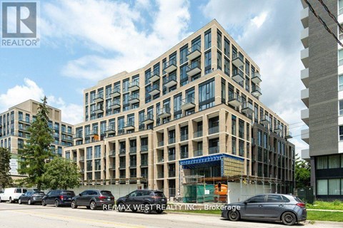 A building with the sign REMAX WEST REALTY INC. Brokerage in front of it.