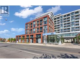 A modern red brick building with the number 858 on it.