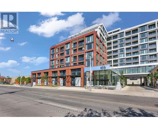 A modern red brick building with the number 858 on it.