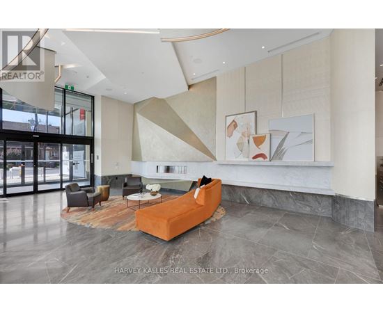 A modern living room with a large orange sofa and a coffee table.