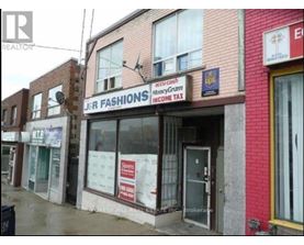 A storefront with a sign that says "J&R FASHIONS".