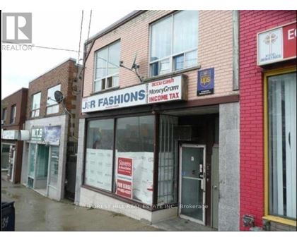 A storefront with a sign that says "J&R FASHIONS".