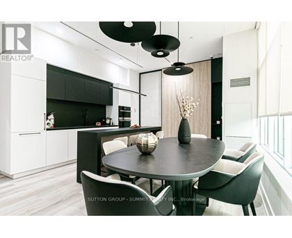 A modern dining room with a table set for four.