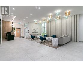 A well-lit, modern office space with a reception desk and comfortable seating areas.