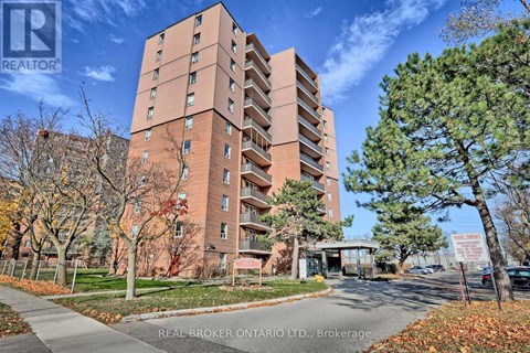 A tall brick apartment building with a sign that says "REAL BROKER ONTARIO LTD, Brokerage" in front of it.