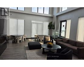 A modern living room with a wooden floor and furniture.