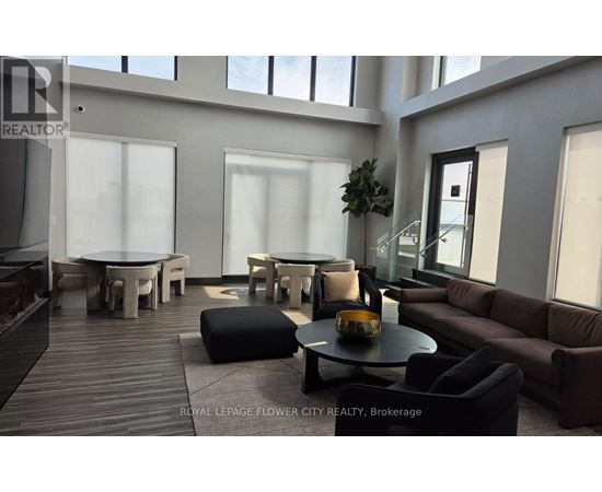 A modern living room with a wooden floor and furniture.