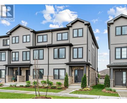 A row of houses with the word REALTOR on the top left corner.