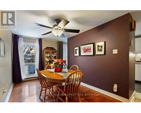 A dining room with a table set for four.