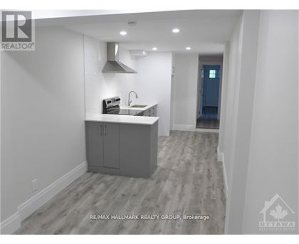 A modern kitchen with a sink and cabinets.