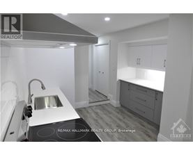 A modern kitchen with a sink and cabinets.
