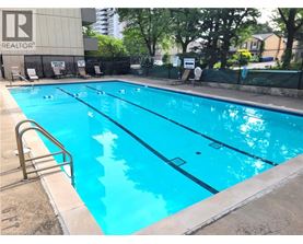 A swimming pool with a ladder on the side.