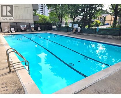 A swimming pool with a ladder on the side.