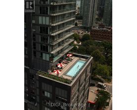 A pool on a balcony of a building with the words "DIGI Brokerage" on the building.