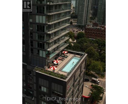 A pool on a balcony of a building with the words "DIGI Brokerage" on the building.
