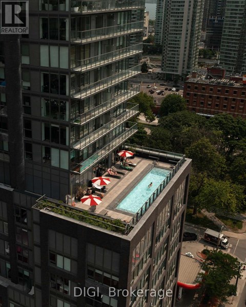 A pool on a balcony of a building with the words "DIGI Brokerage" on the building.