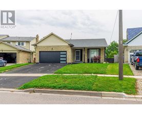 A house with a garage is for sale by REALTY ONE GROUP REVEAL Brokerage.