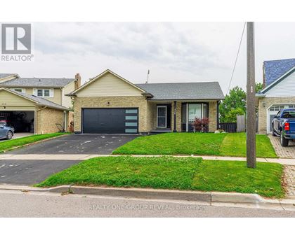 A house with a garage is for sale by REALTY ONE GROUP REVEAL Brokerage.
