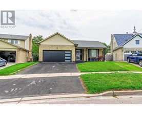 A house with a garage is for sale.