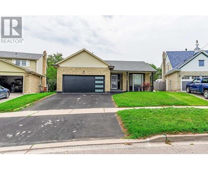 A house with a garage is for sale.