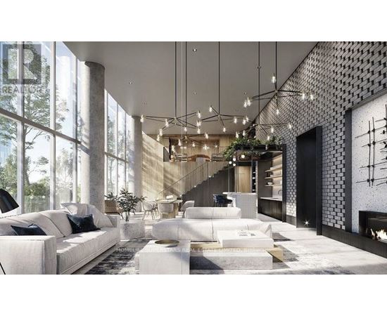 A modern living room with a staircase leading to the upper floor.