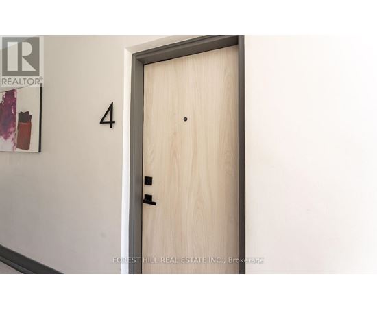 A door with a number 4 on the wall above it.