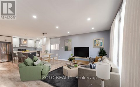 A modern living room with a green sofa and a television.